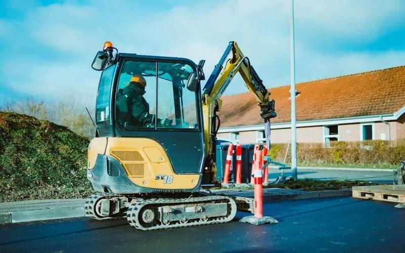 Used excavator using jack hammer attachment