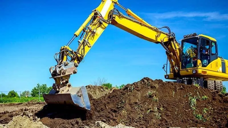 Excavator digging soil