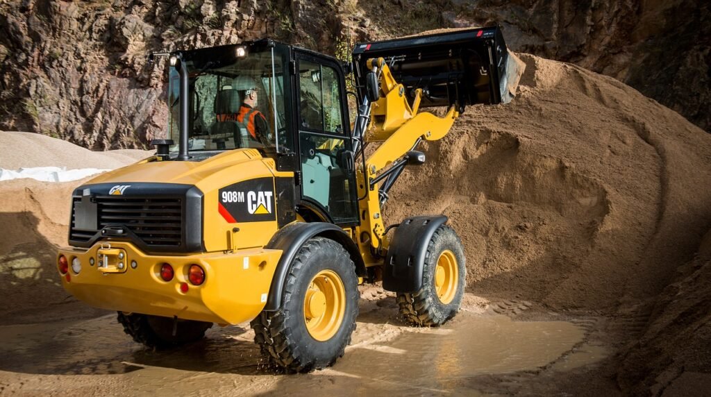 Wheeled loaders dumping soil