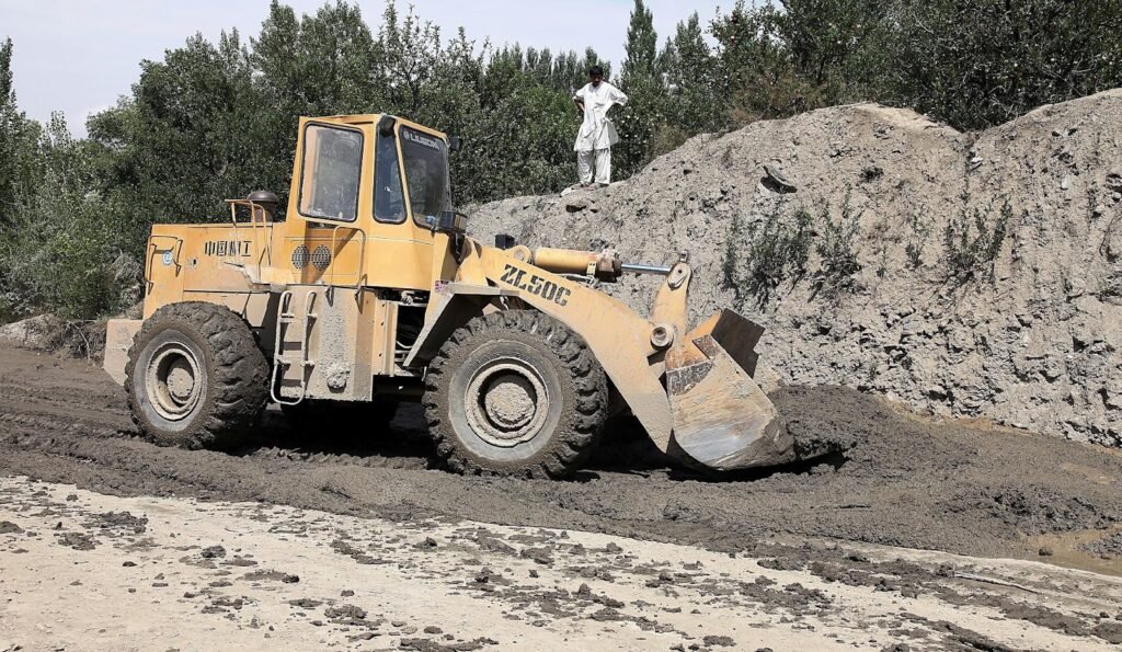 Wheeled loaders excavating soil