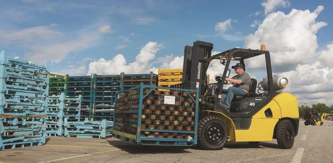 man is driving forklift