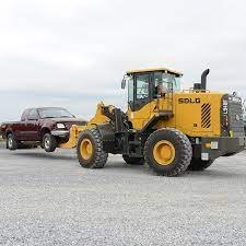 SDLG Wheel Loader towing a car