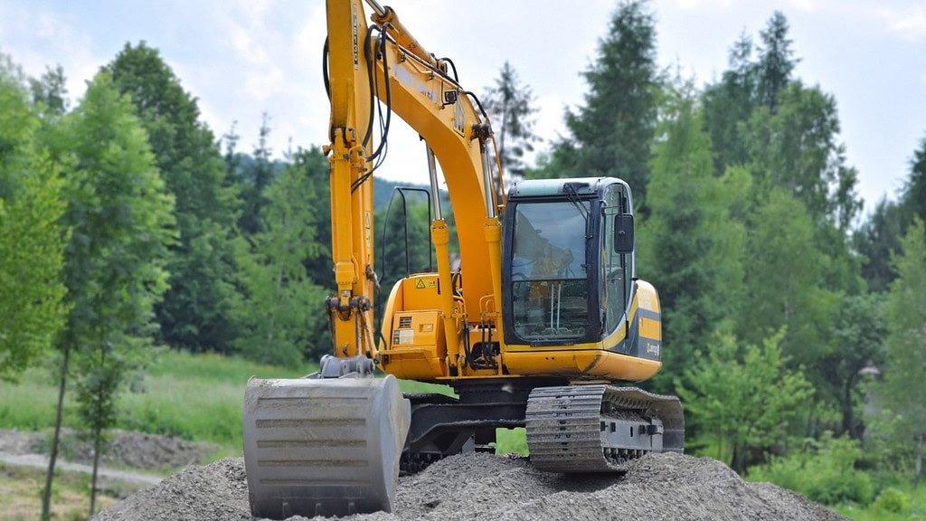 used excavator on the sand