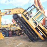 Excavatrice Caterpillar 320B d'occasion en bon état